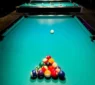 Pool table with billiard balls arranged for a game